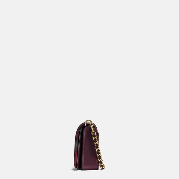 Grey and maroon small handbag with white background, Elegant maroon leather sling bag with golden chain and black sling with white background