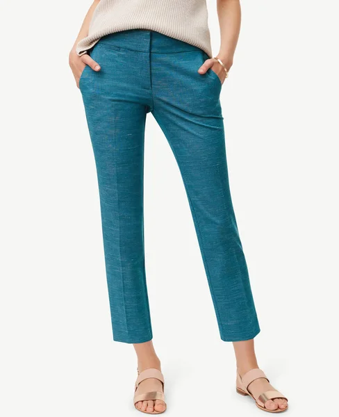 Sea green pants for women’s paired with flat footwear and white background — Stock Photo, Image