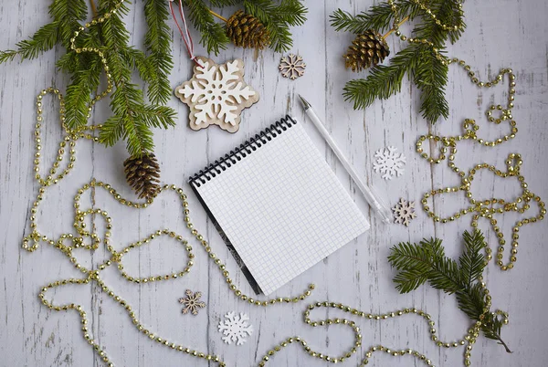 New Year's Notebook and white pen for writing goals and objectives for the next year on a light wooden background — Stock Photo, Image