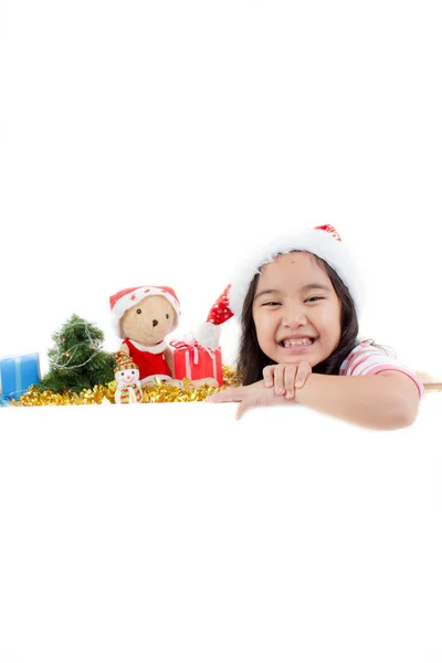 Happy Asian child in Santa hat holding white board with Christma — Stock Photo, Image