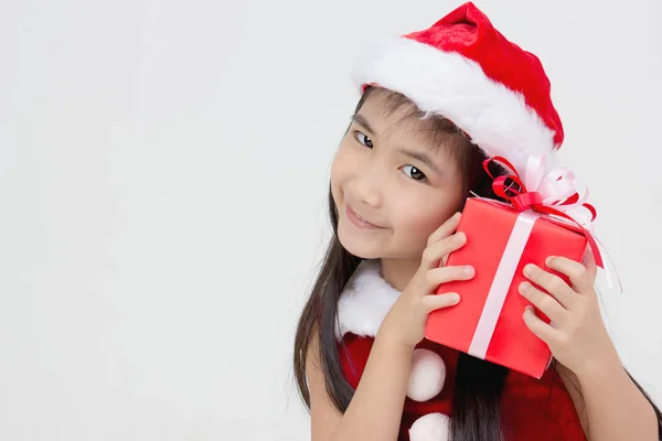 Portrait of happy little Asian girl in red Santa dress — Stock Photo, Image