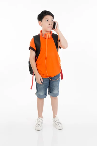 Happy asian boy using cell phone . — Stock Photo, Image