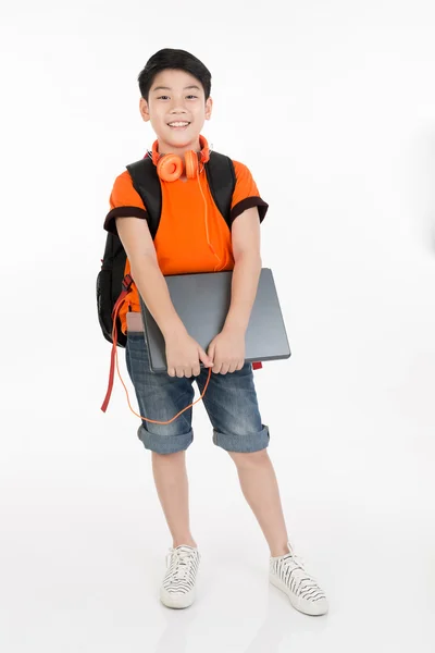 Happy asian boy holding laptop . — Stock Photo, Image