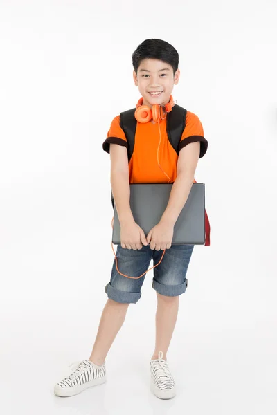 Happy asian boy holding laptop  . — ストック写真