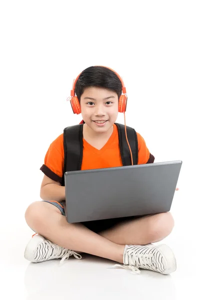 Happy asian boy using laptop . — Stock Photo, Image