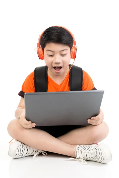 Happy asian boy using laptop . — Stock Photo, Image