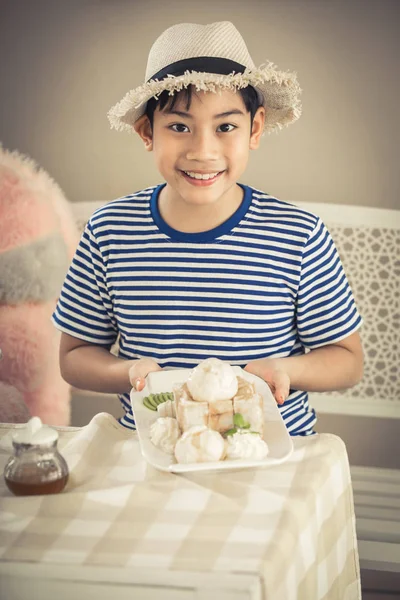 Asian Cute boy enjoying sweet food. — Stock Photo, Image