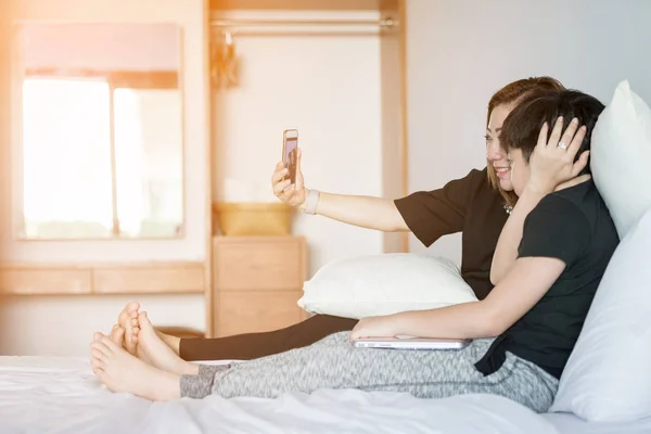 Happy asian mother and son take a photo at home . — Stock Photo, Image