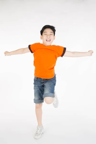 Asian cute child is jumping — Stock Photo, Image