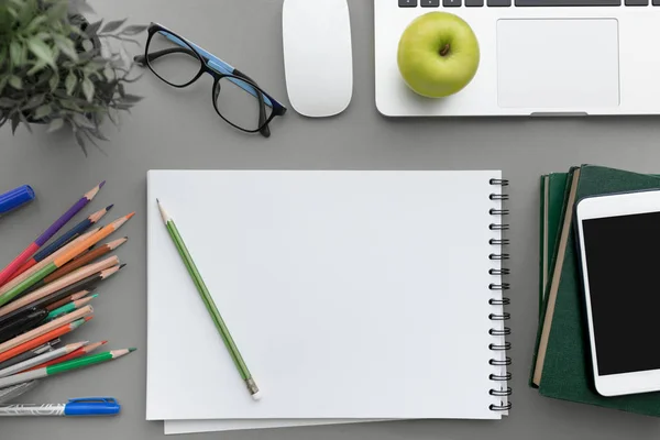 Top view, flat lay of Modern gray office desk table with laptop — Stock Photo, Image