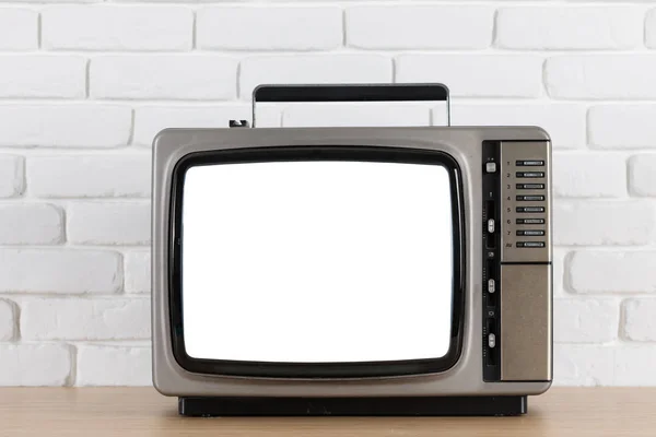 Stary telewizor z ekranem wyciąć na biały mur — Zdjęcie stockowe