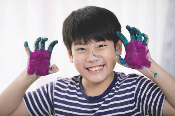 Happy asian boy painting paint. — Stock Photo, Image