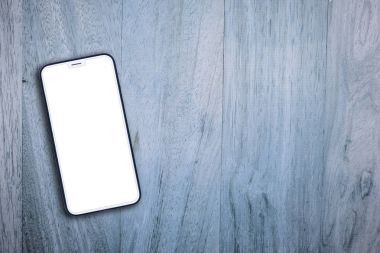 Ahşap arka plan üzerinde mobil cep telefonu