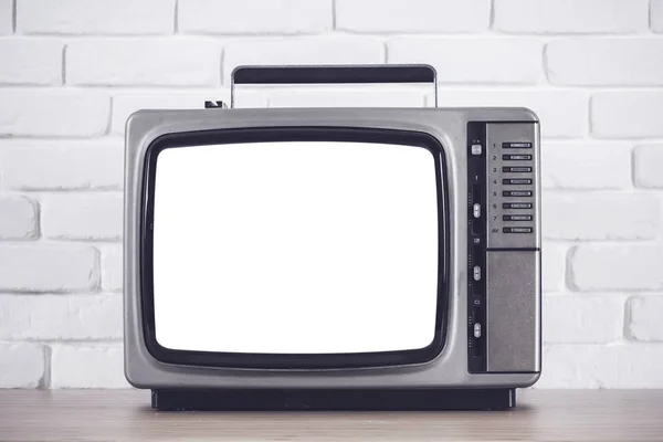 Stary telewizor z ekranem wyciąć na biały mur — Zdjęcie stockowe