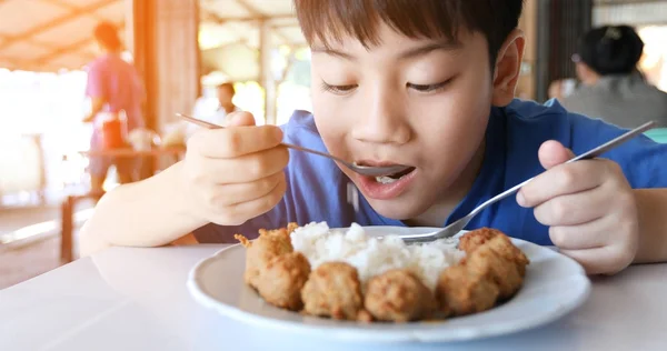 Asian cute boy eat breakfast and looking camera with smile face — Stock Photo, Image