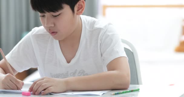 Happy Asian Cute Boy Hand Holding Pencil Writing Your Homework — Stock Video