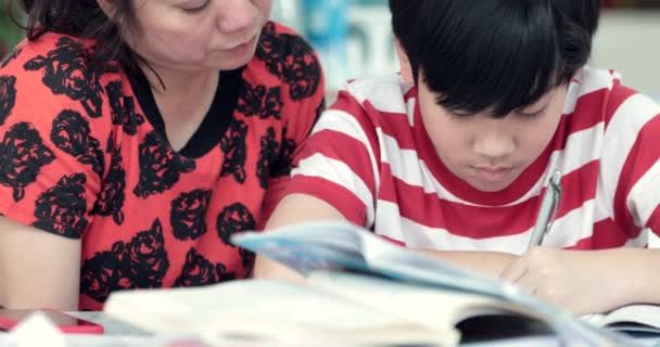 Serious Asian Mother Son Doing Homework Living Room Mom Teaches — Stock Video