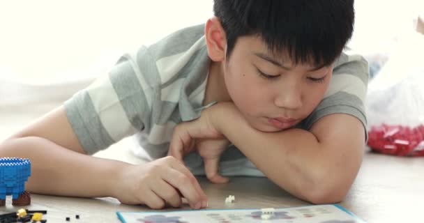 Cute Asian Boy Playing Plastic Block Home Smile Face — Stock Video