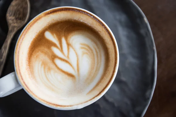 Koffiekopje latte art — Stockfoto