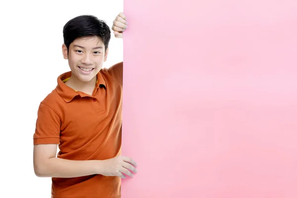 Boy holds blank sign. Teen boy holds empty billboard. — Stock Photo, Image