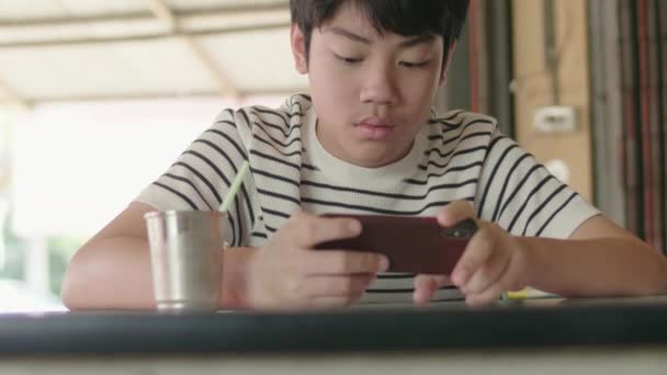 Child Boy Playing Mobile Phone Cafe Kid Using Smartphone Smile — Stock Video