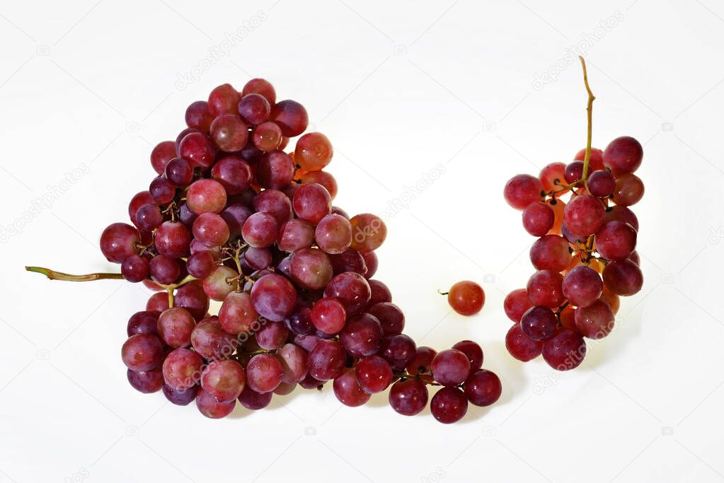 Two Bunches of fresh wine pink grapes falling isolated  on a white background big size high resolurion
