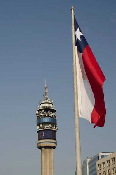 Entel Tower and flag of Chile in the Libertador Bernardo OHiggins Avenue.