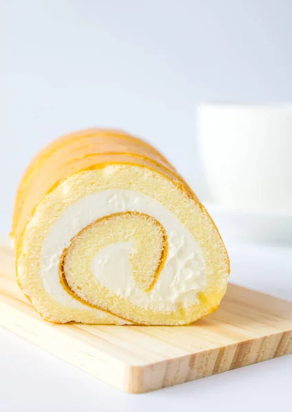 Swiss roll and coffee on white background. — Stock Photo, Image