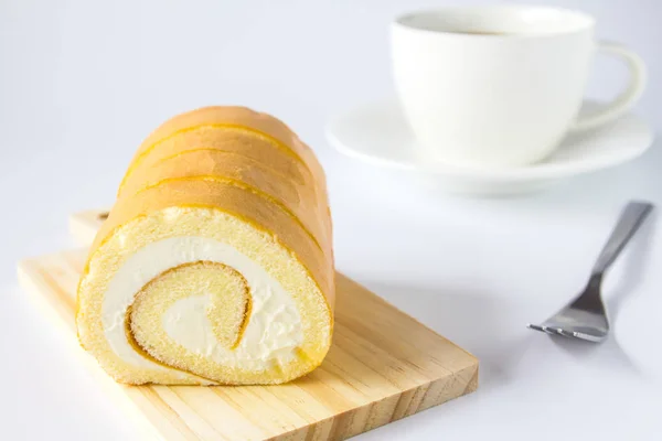 Swiss roll and coffee on white background. — Stock Photo, Image