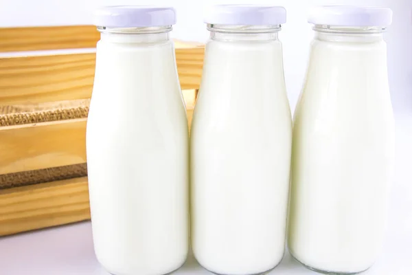 Milk bottle in the box — Stock Photo, Image