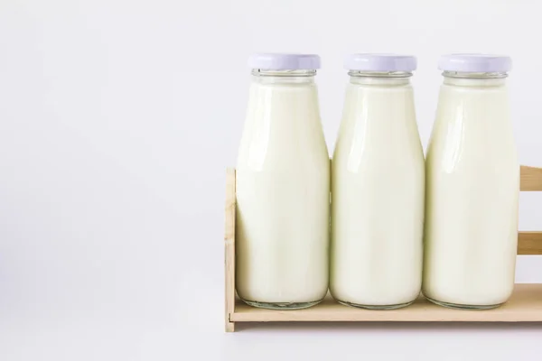 Milk bottle in the box — Stock Photo, Image