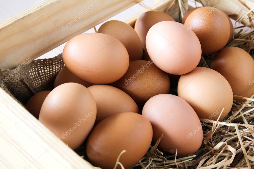 Eggs in wooden box.