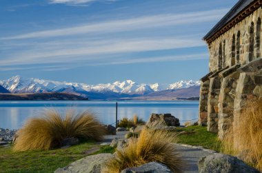 Lake Tekapo with snow covered mountains in the background and Church of the Good Shepherd in the foreground, Canterbury, South Island, New Zealand clipart