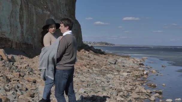 Young Couple Walk Rocky Shore Rock River Covered Ice Sunny — 비디오