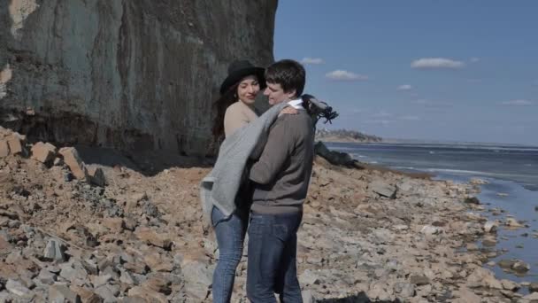 Young Couple Walk Rocky Shore Rock River Covered Ice Sunny — Stock Video