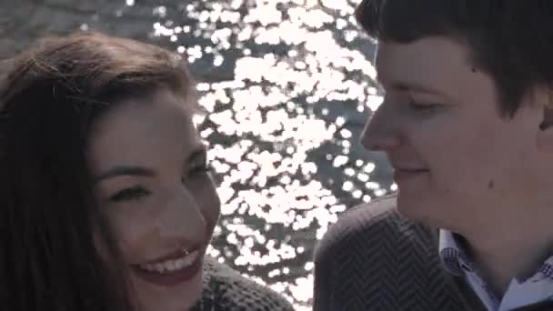 Date Young Couple River Bank Background Sun Glare Sunny Spring — Stockvideo