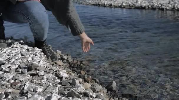 Young Girl Moisturizes Her Hand Dipping Clear Water Rocky Shore — 图库视频影像