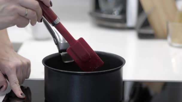 Female Hand Stirs Food Black Saucepan Cooking Spatula — Stock Video