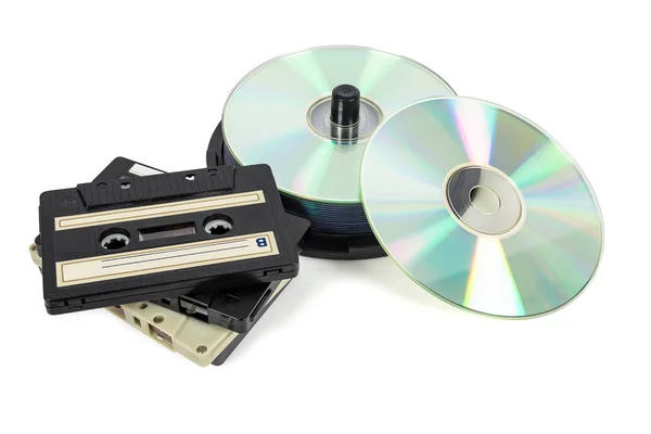 Stacks of CDs on spool and audio tapes — Stock Photo, Image