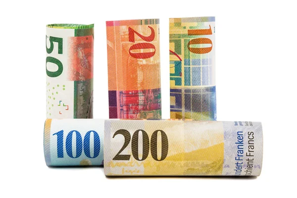 Ensemble de billets roulés en francs suisses — Photo