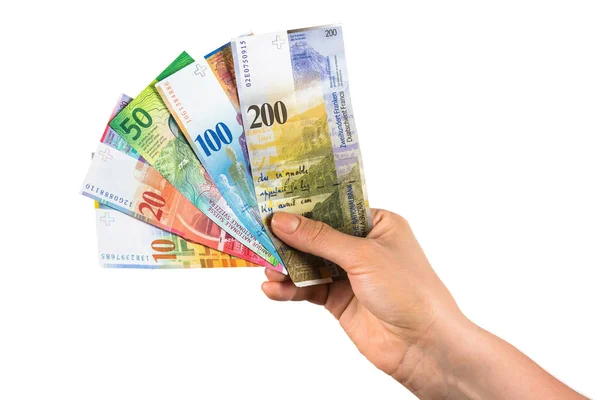 Hand holding swiss franc banknotes — Stock Photo, Image