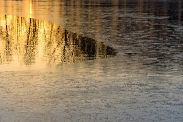 Half frozen lake at sunset — Stock Photo, Image