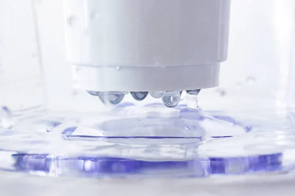 Close up of water drops in a filter jug for water purification. drinking purified water.