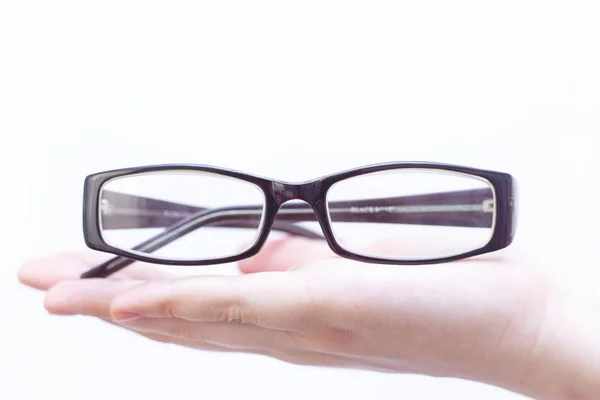 Brille Zur Sehkorrektur Einem Dunklen Rahmen Der Handfläche Liegen Auf — Stockfoto