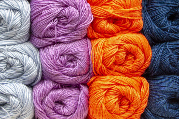 background texture of acrylic multicolored yarn. Beautiful thread pattern. balls of yarn. 