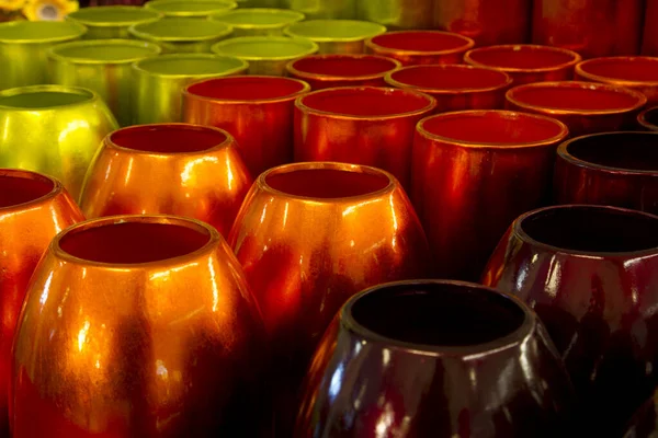 Lot of green, orange and brown vases — Stock Photo, Image