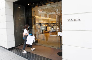 Coruna-Spain.The first store opened by the 'Inditex' group, under the name 'Zara', in the center of Corua, reopened today after being closed due to the covid-19 coronavirus on May 07,2020 clipart