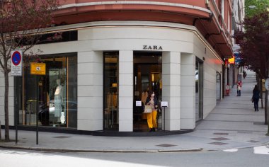 Coruna-Spain. Buyers in the first store opened by the 'Inditex' group, under the name 'Zara' after reopening today after being closed by the covid-19 on May 7, 2020 clipart
