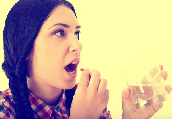 Woman taking pill — Stock Photo, Image