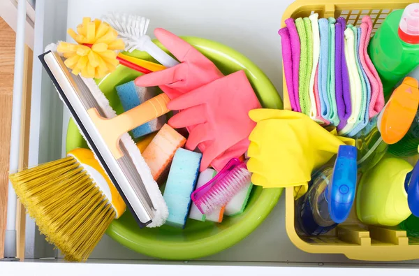 Cleaning supplies in drawer — Stock Photo, Image